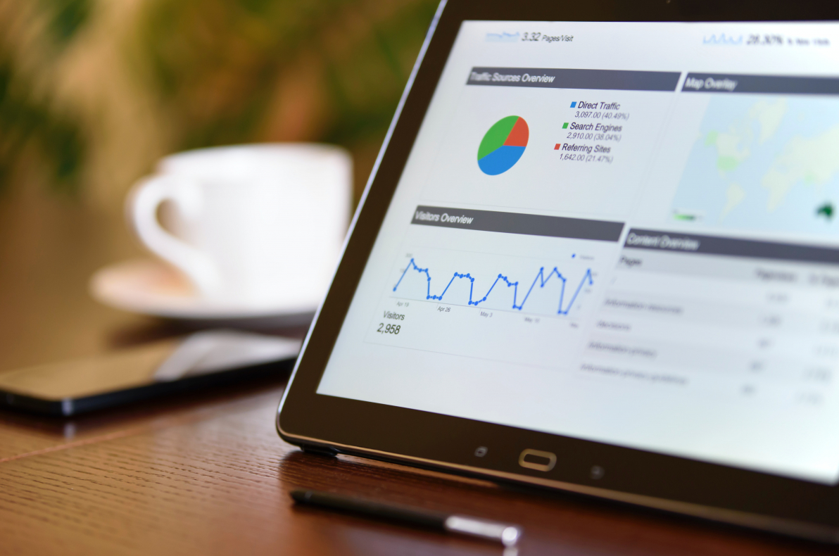 analytics dashboard viewed on a tablet sitting on a table