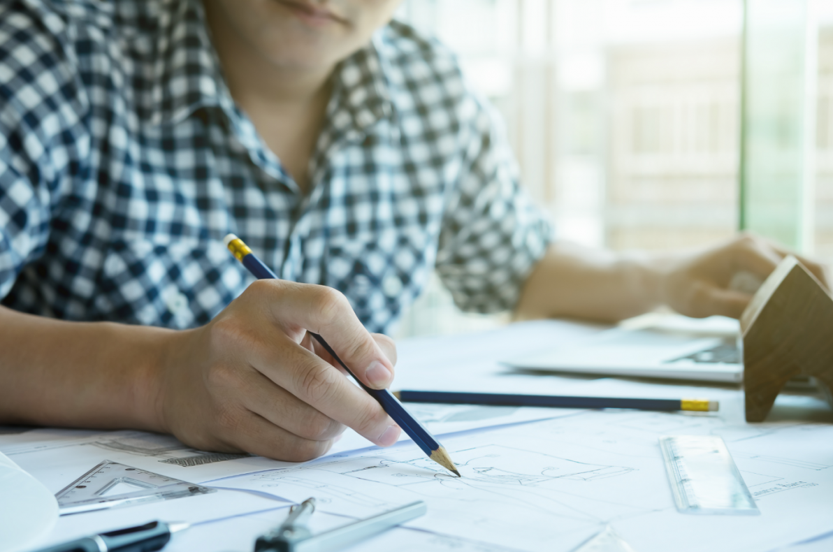 Close up Man Working of Architect Sketching a Construction Project