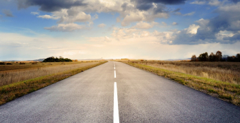 Paved asphalt road into the horizon